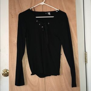 a slightly tight fitted, long sleeve lace shirt